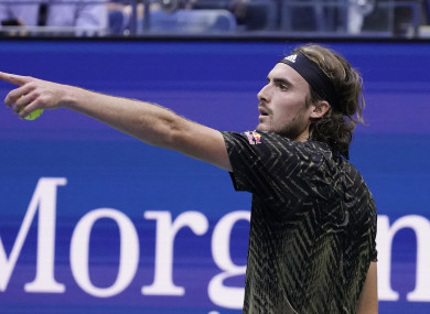 Stefanos Tsitsipas, of Greece, speaks with an official during a match with Carlos Alcaraz.
