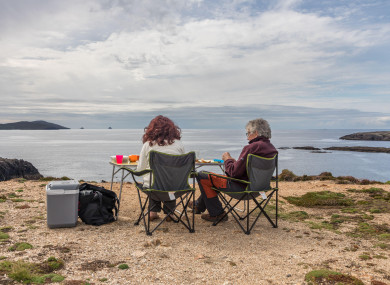 Holidaymakers Martine Vandeveegaete and Andre Derval from Lessines in Belgium having an afternoon picnic with a view of Beara's Wild Atlantic Way on 11 September
