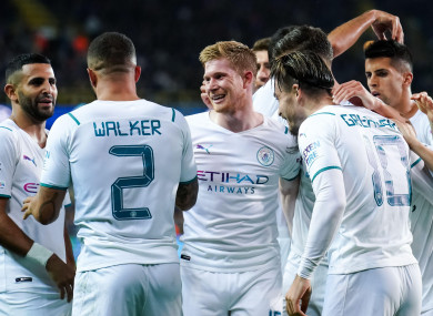 Man City players celebrate during their victory over Brugge.