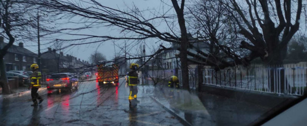 Firefighters in North Strand in Dublin dealing with fallen trees.