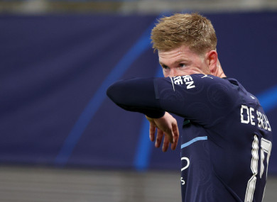 Kevin De Bruyne wipes off his sweat.