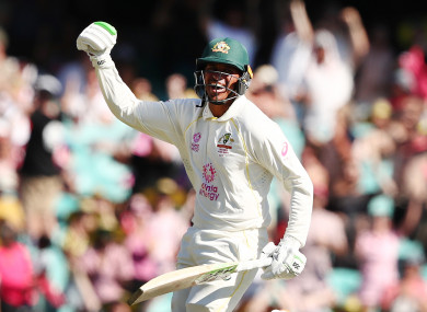 Usman Khawaja celebrates his century.