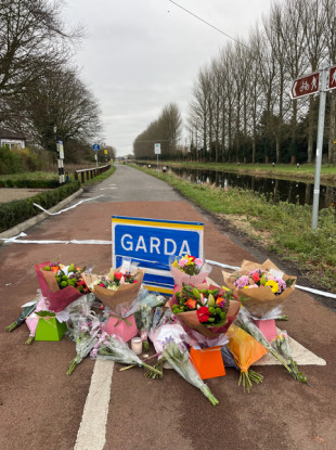 Flowers and a card left at Fiona's Way following the death of Ashling Murphy.