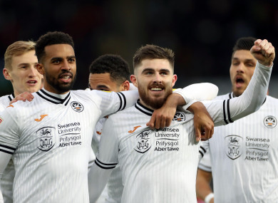Swansea City's Ryan Manning (centre) celebrates with team-mates