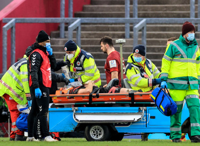 Thomas Young was stretchered off at Thomond Park yesterday.