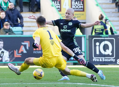 Celtic's Daizen Maeda an Hibernian goalkeeper Matt Macey.
