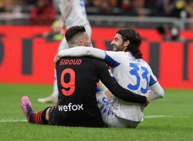 Olivier Giroud of AC Milan and Sebastiano Luperto of Empoli FC during tonight's clash.