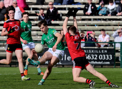 Taidgh O'Hanlon of Down attempts to block a shot by Fermanagh's Cian O'Brien during the preliminary round of the 2022 Electric Ireland Ulster MFC.