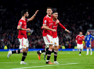 Man United players celebrate Ronaldo's goal.