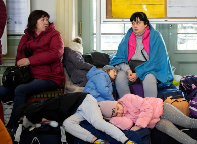 Ukrainian refugees pictured at a train station in Przemyśl in Poland in March