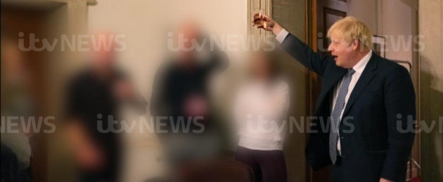 Boris Johnson holding a glass during a leaving party on 13 November 2020
