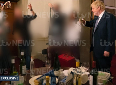 Boris Johnson holding a glass during a leaving party on 13 November 2020.