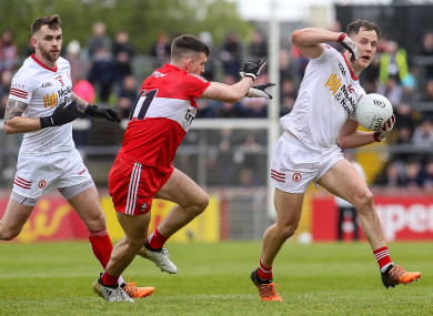 Tyrone's Kieran McGeary and Derry’s Shea Downey.