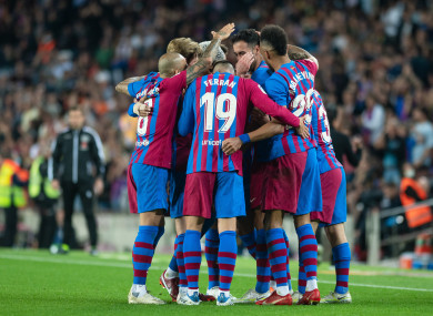 Barcelona celebrate a goal by Sergio Busquets.