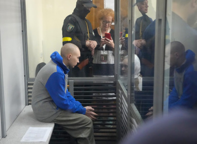 Russian army Sergeant Vadim Shishimarin, 21, is seen behind a glass during a court hearing in Kyiv.