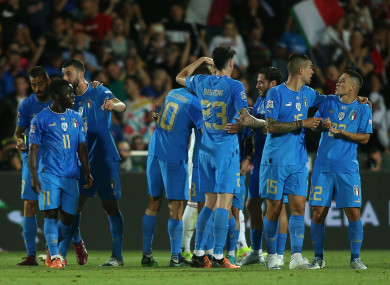 Italy players celebrate.