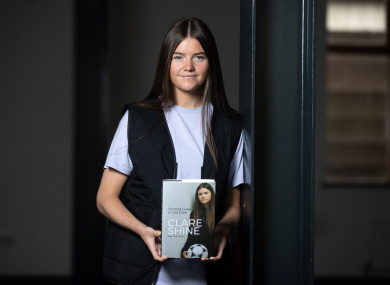 Clare Shine with her book, 'Scoring Goals In The Dark'.