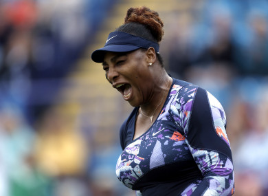 Williams celebrates winning a point during her doubles match.