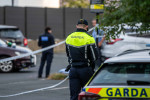 A Garda forensic team examining the scene in Dalkey on Sunday evening