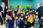 GAA Palestine founder Stephen Redmond with children from the Moataz Sarsour Club in Al Am'ari Camp, in the West Bank.