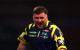 ‘Settled’ world champion Luke Littler wastes little time beating Mensur Suljovic