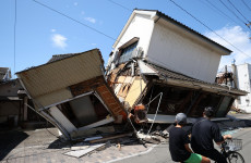 Powerful earthquake in Japan leaves at least 13 dead as efforts to rescue survivors continue