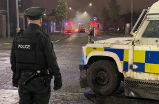Police cars damaged as up to 100 young people throw masonry at officers and set bins alight