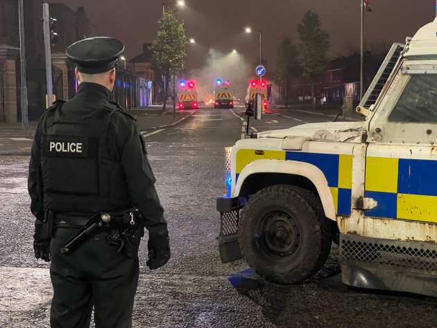 Police cars damaged as up to 100 young people throw masonry at officers and set bins alight